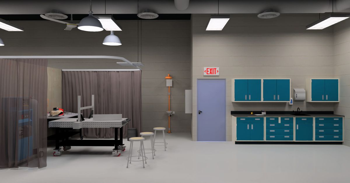 welding lab rendering showing fixutre tables, safety curtains and blue metal casework cabinets for storage